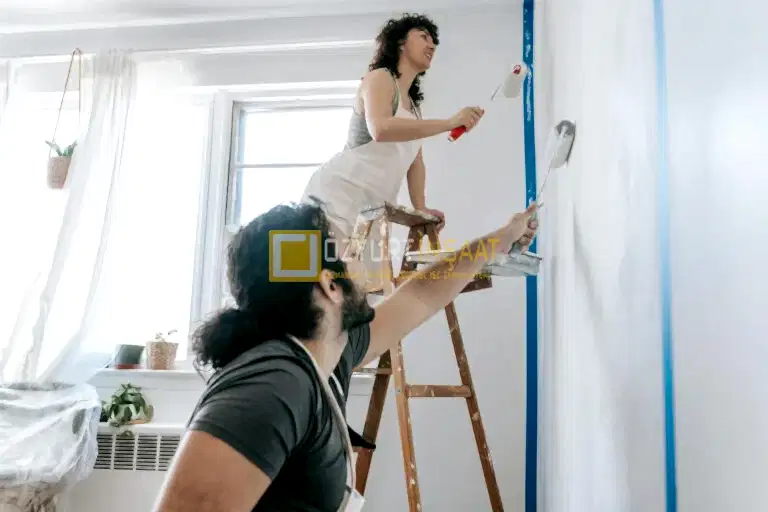 couple painting a wall